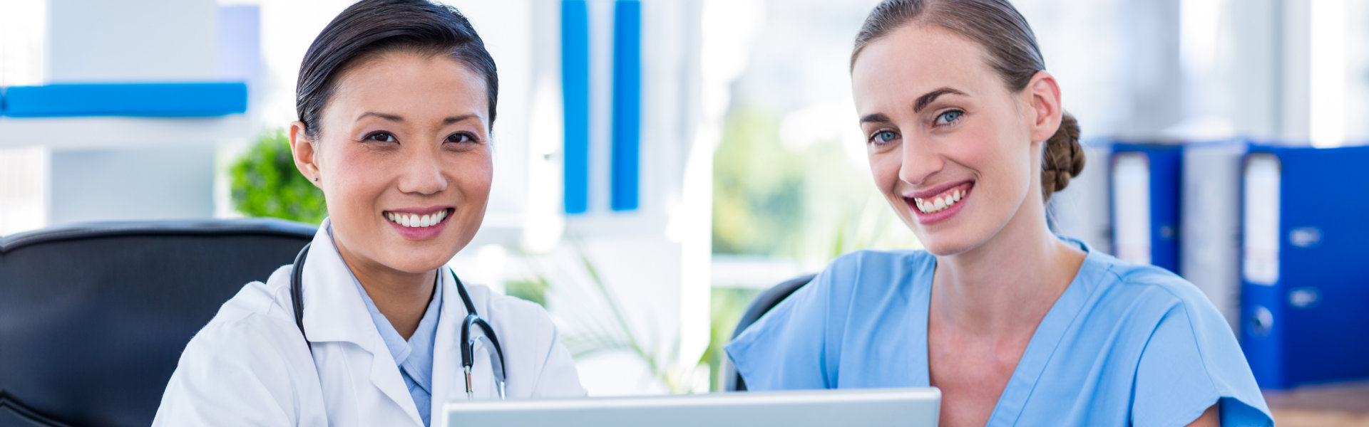 two nurses smiling